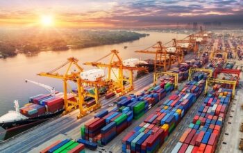 Logistics and transportation of Container Cargo ship and Cargo plane with working crane bridge in shipyard at sunrise, logistic import export and transport industry background